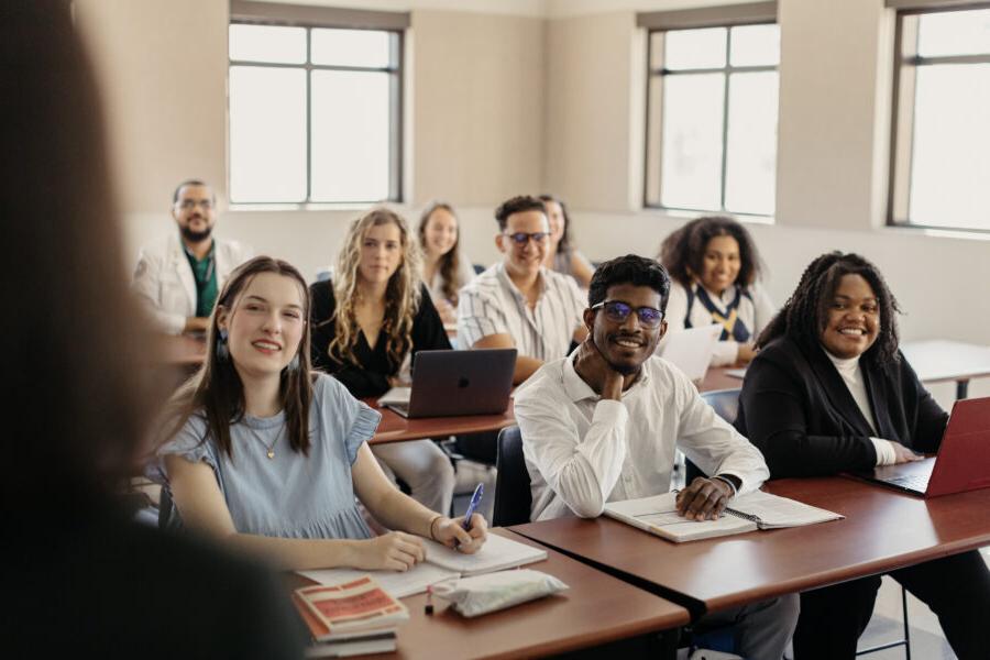 students sitting at desks in a classroom